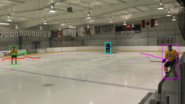 The “magenta” player nears the edge of the field and becomes partly obscured behind the fence - still we are able to detect and track him precisely scene03115